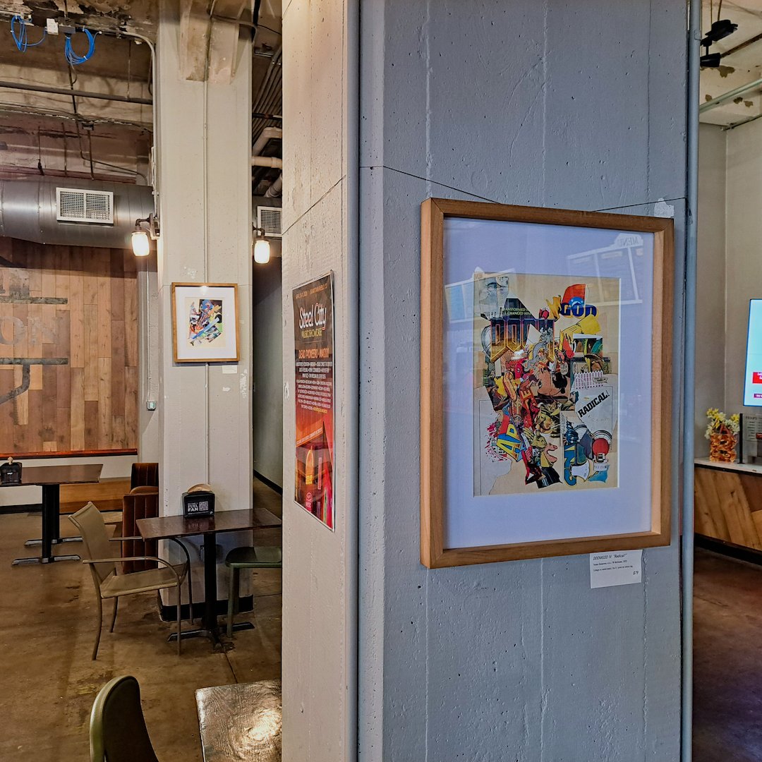 The work on display, hanging on a concrete pillar in a wooden frame.