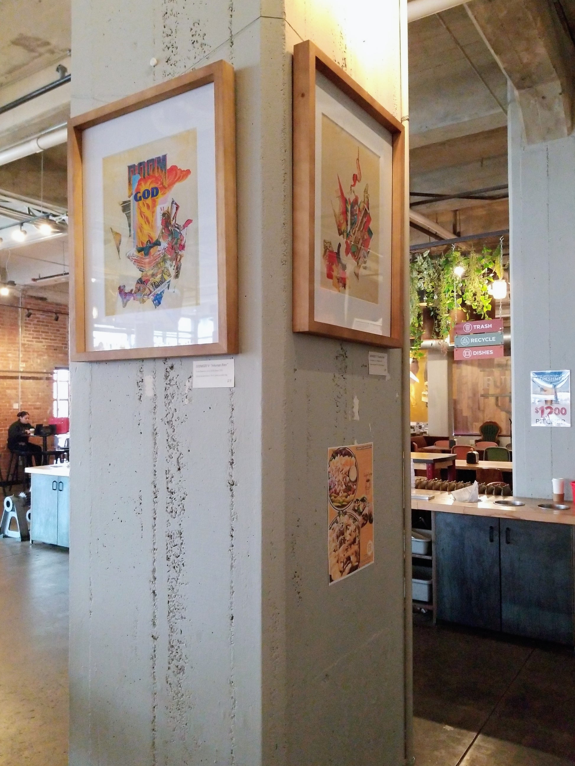 The work on display, hanging on a concrete pillar in a wooden frame.