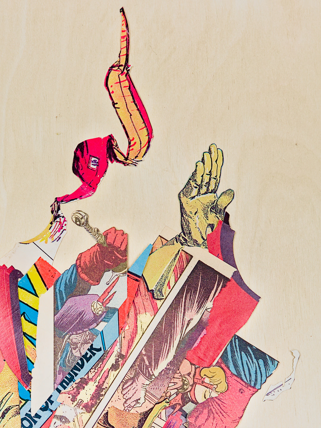 A crop of the top of the work with the diagonal composition of clippings bursting into the frame from the lower-left like a bomb blast from off-screen.